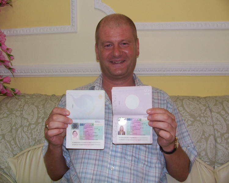 Happy client smiling with his visas