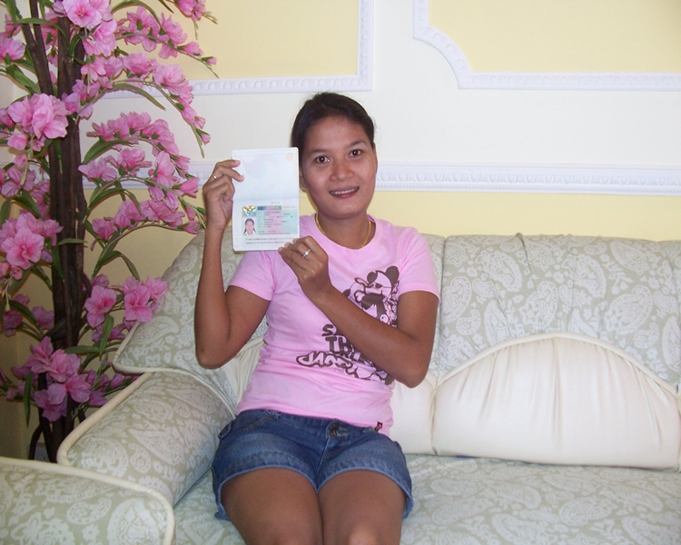 Happy client smiling with her visa