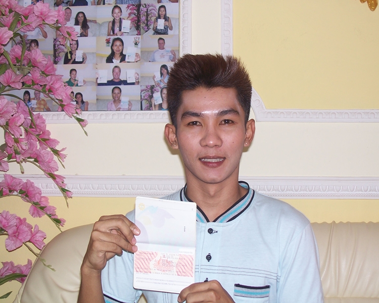 Happy client smiling with his visa