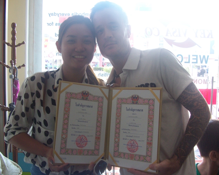 Happy clients smiling with their framed official documents