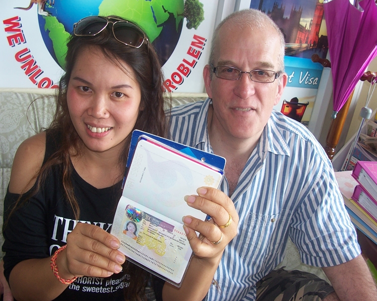 Happy clients smiling with their visa