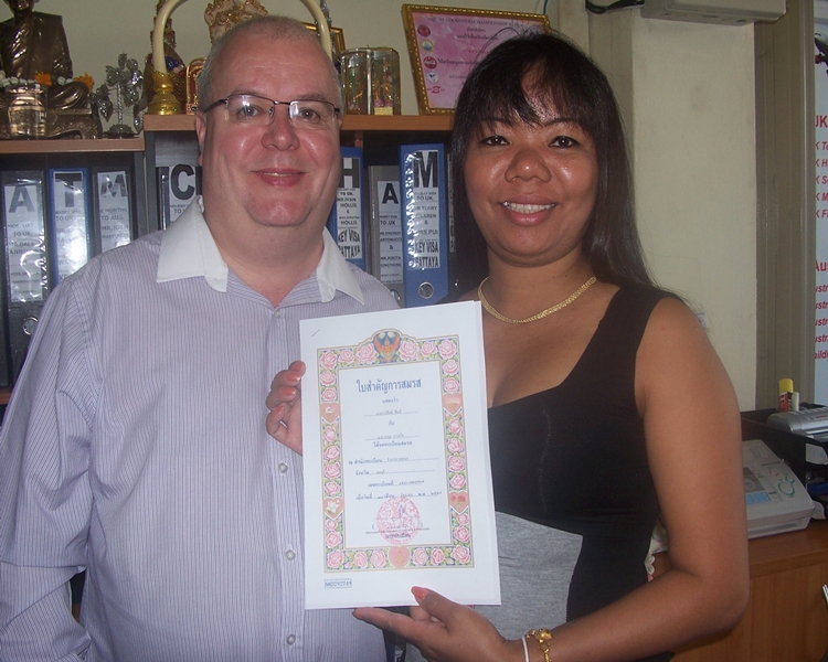 Happy clients smiling with their official documents