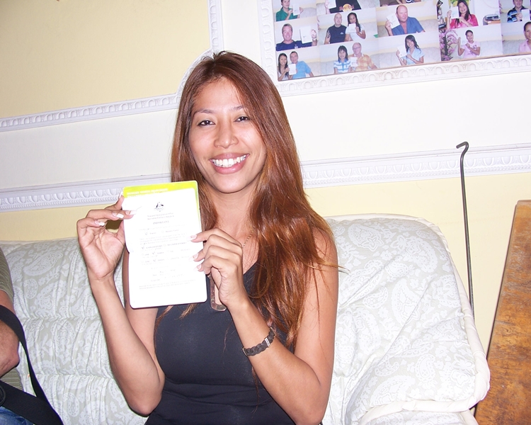Lawan smiling with her visa