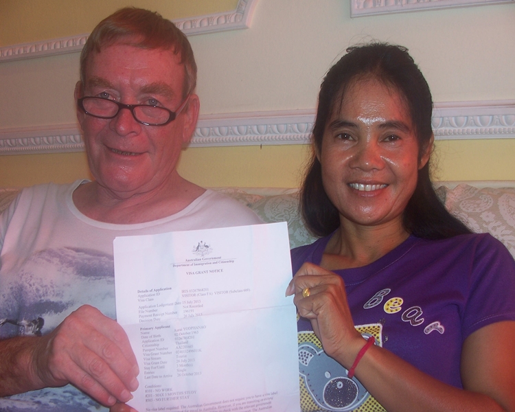 Happy clients smiling with their visa