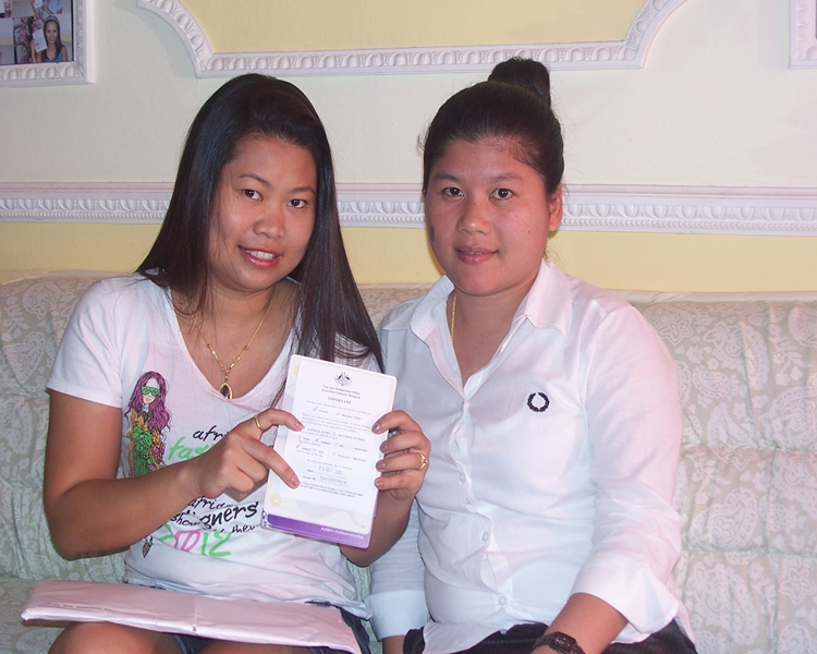 Happy clients smiling with their visa