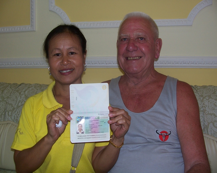 Happy clients smiling with their visa