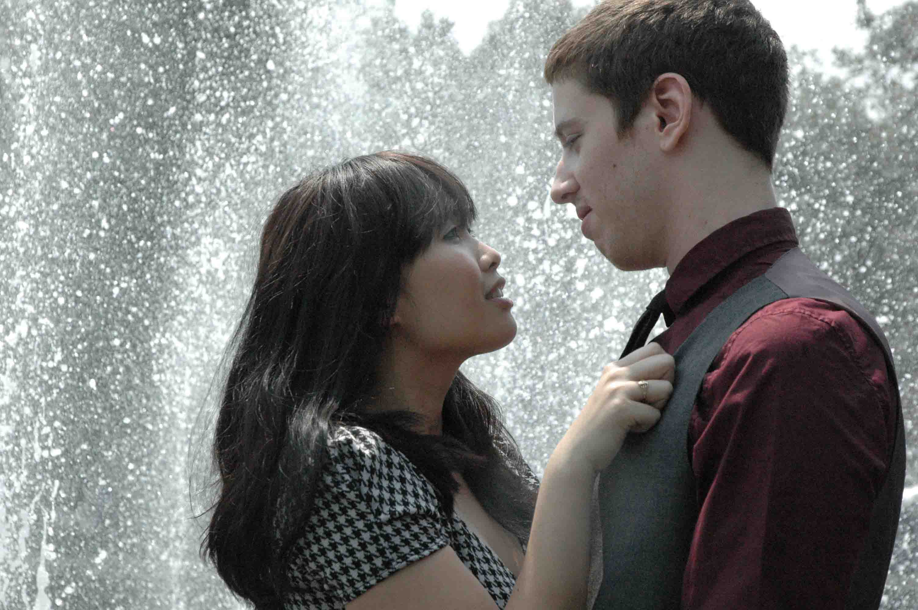 An attractive interracial couple in the rain