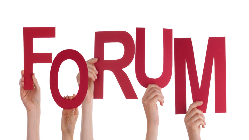 Hands Holding Up Letters Spelling "FORUM"