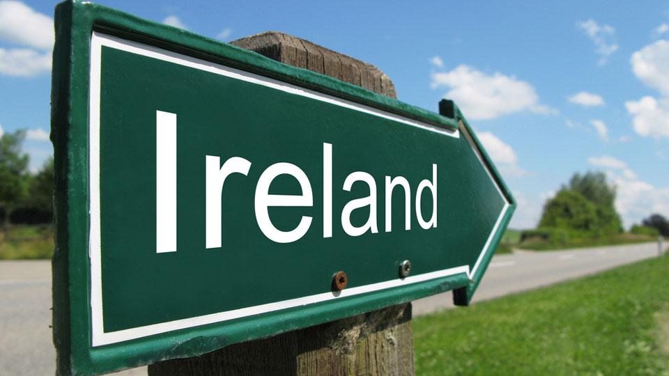 Road Sign Pointing To Ireland
