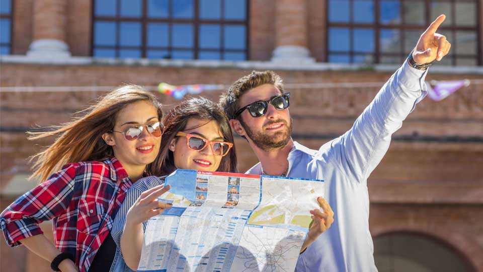 Three People Consulting a Map and Pointing