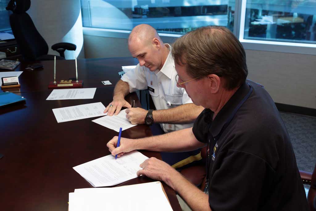 Men preparing documents