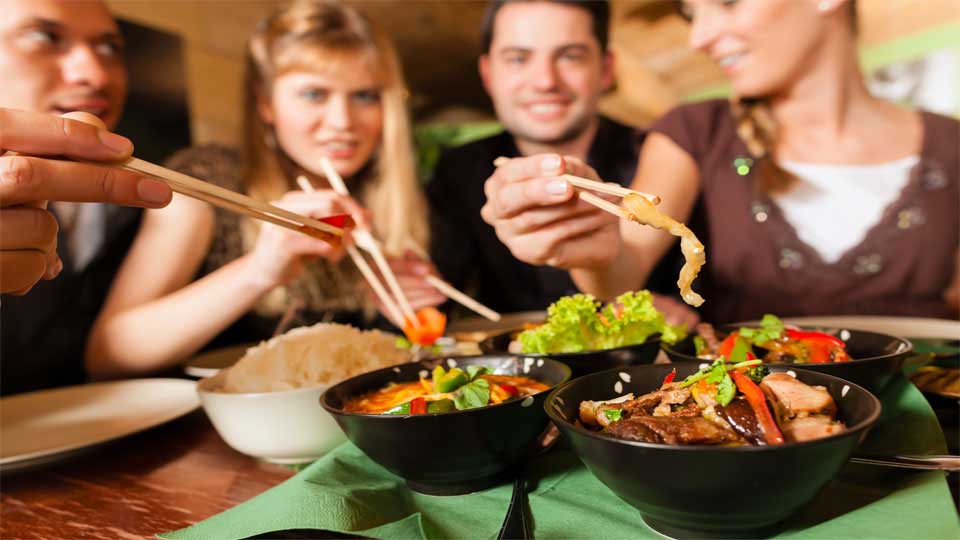 Two Couples Eating Hip Thai Food at a Restaurant