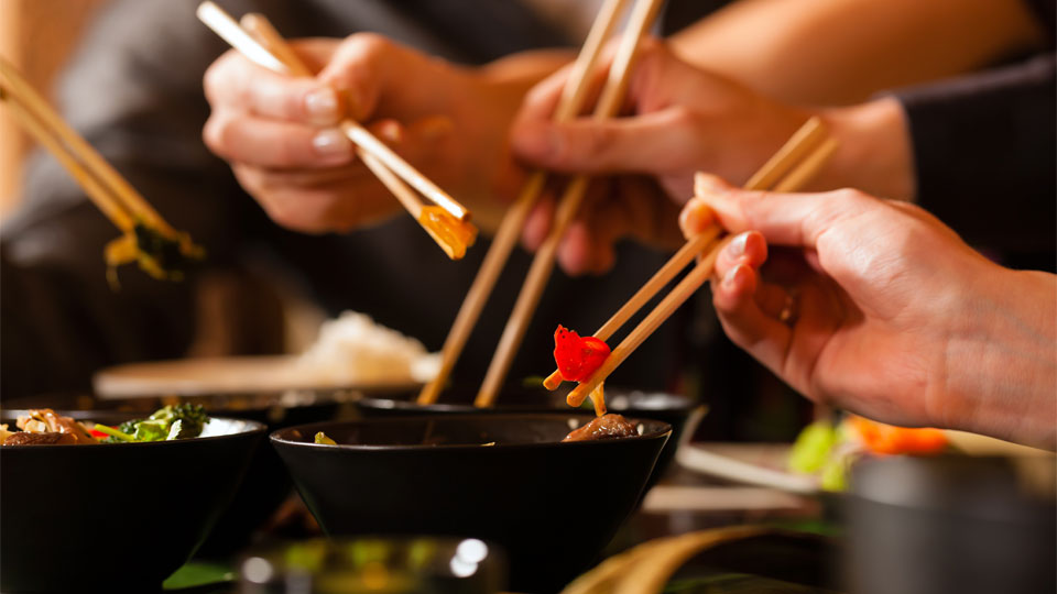 People eating with chopsticks