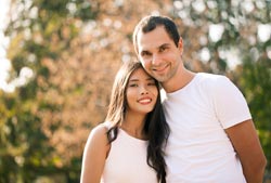 A happy Asian / Caucasian couple in autumn