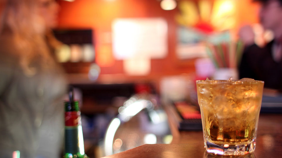 Tumbler of Liquor on a Bar