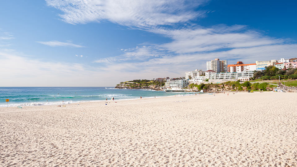 Pristine beach scene, resort condominiums in the background