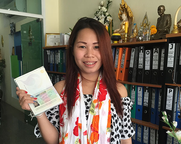 happy thai lady with her uk tourist visa