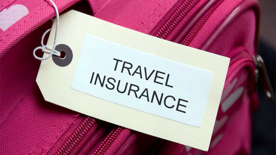 Suitcase tag marked "Travel insurance."